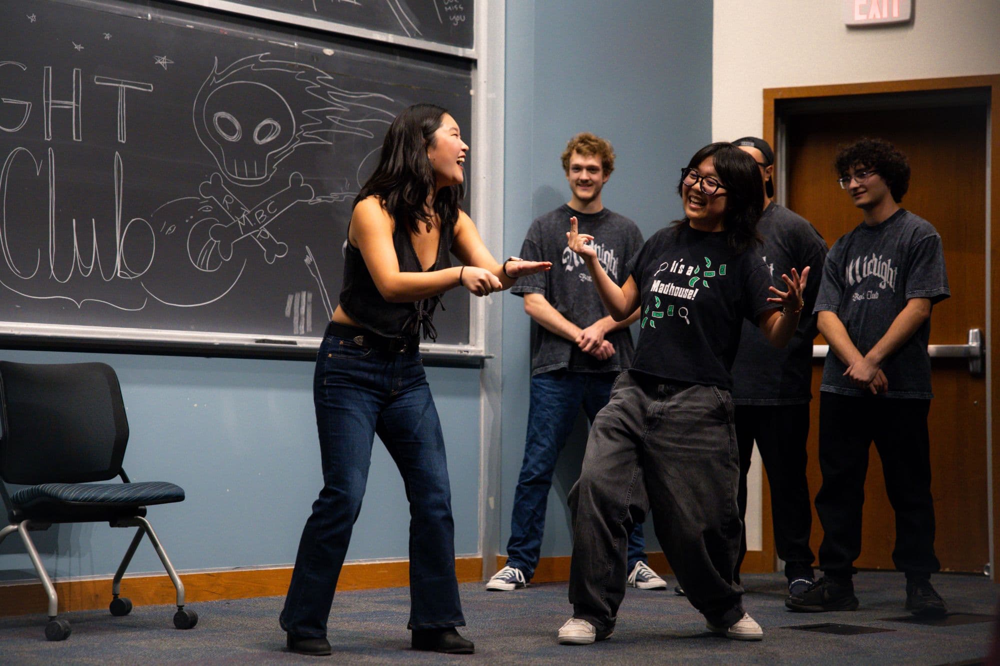 Two performers mid-scene at an improv show